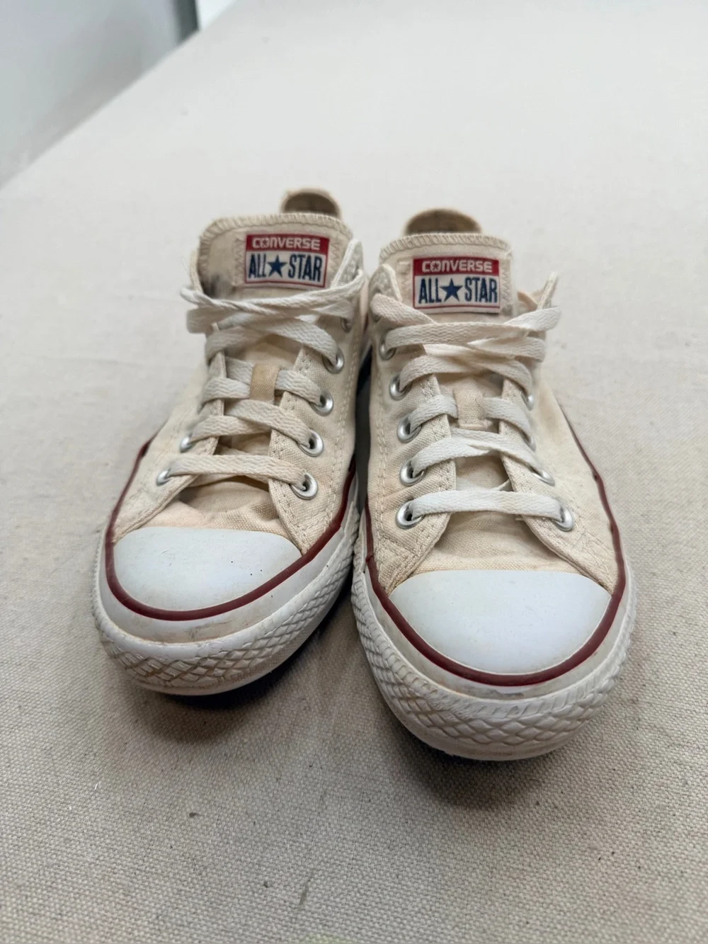 Converse Low Top Sneakers in Cream with Red Trim